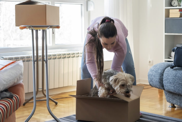 Young woman moving into a new apartment.